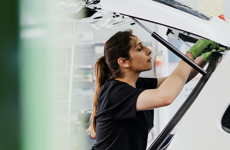 woman cleaning car